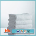 Wholesale super cheap 100% cotton fabric plain dyed size face towel for hotel